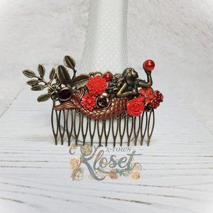 Red mermaid holding a red pearl hair comb